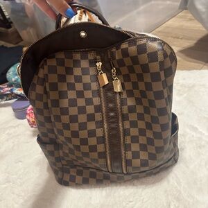 Brown checkered backpack purse